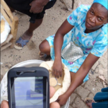 mobile phone in use during food distribution in Haiti