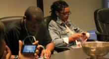 Youth from Youth Radio Mobile Action Lab work on apps